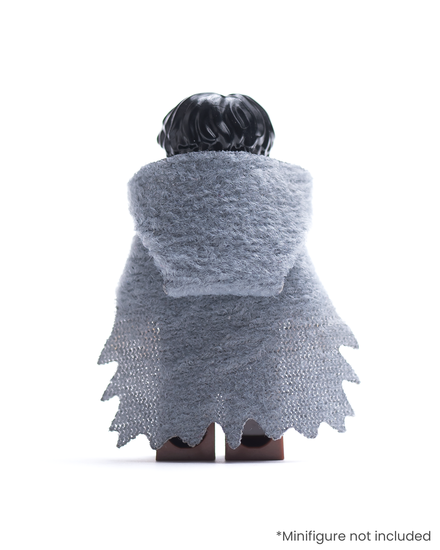Rear view of LEGO minifigure wearing a dark gray hood and tattered cape on a white background