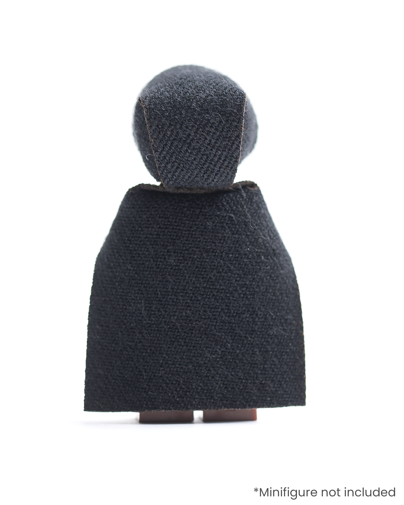 Rear view of LEGO minifigure wearing a black hood and cloak on a white background