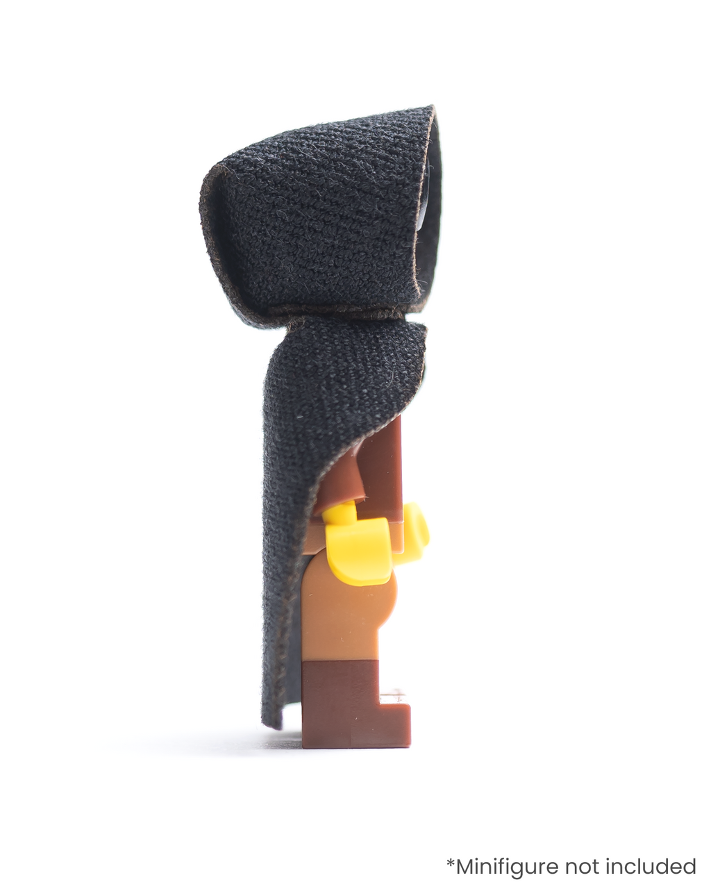 Side view of LEGO minifigure wearing a black hood and cloak on a white background