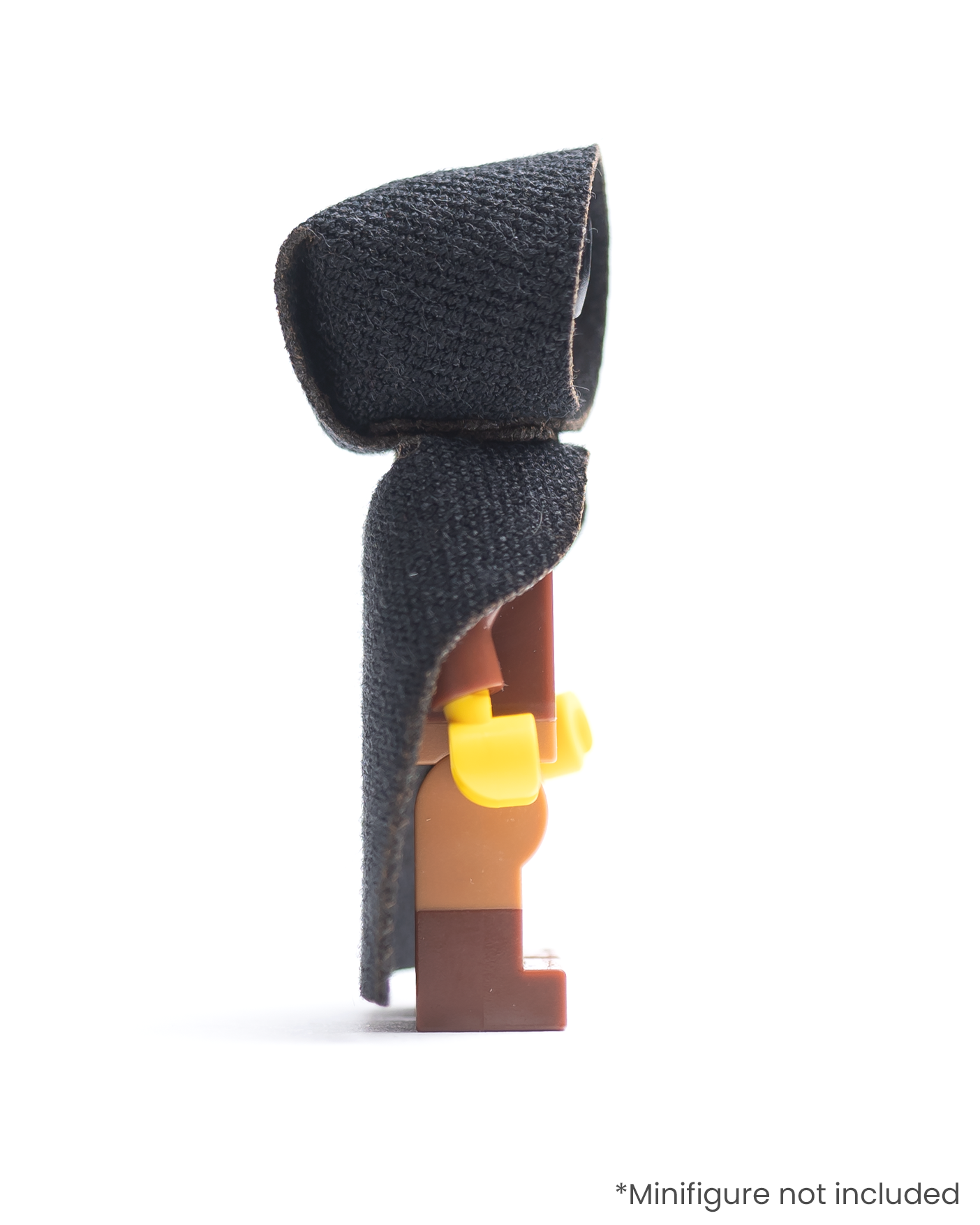 Side view of LEGO minifigure wearing a black hood and cloak on a white background