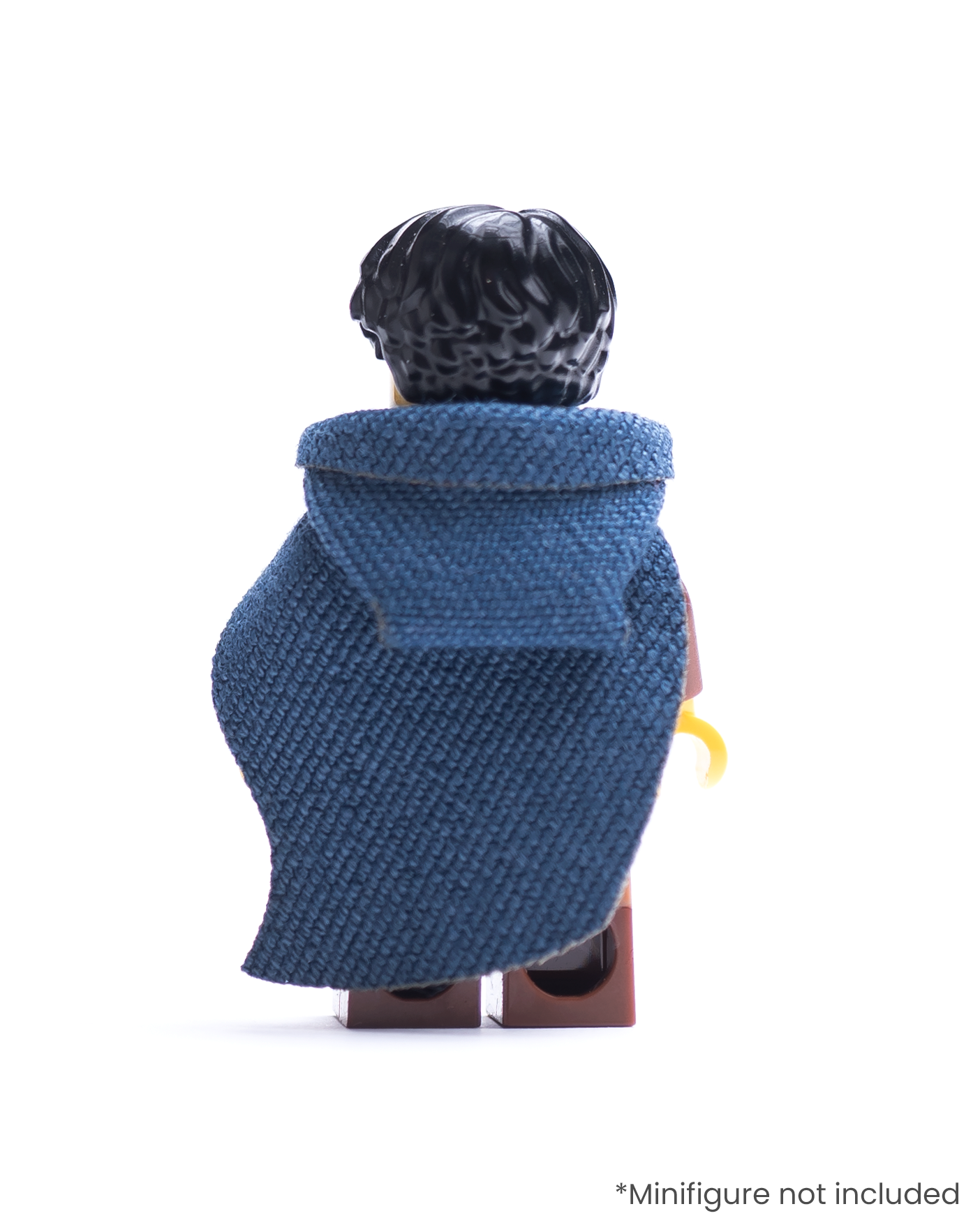 Rear view of LEGO minifigure with brown outfit and blue hood and cape on a white background