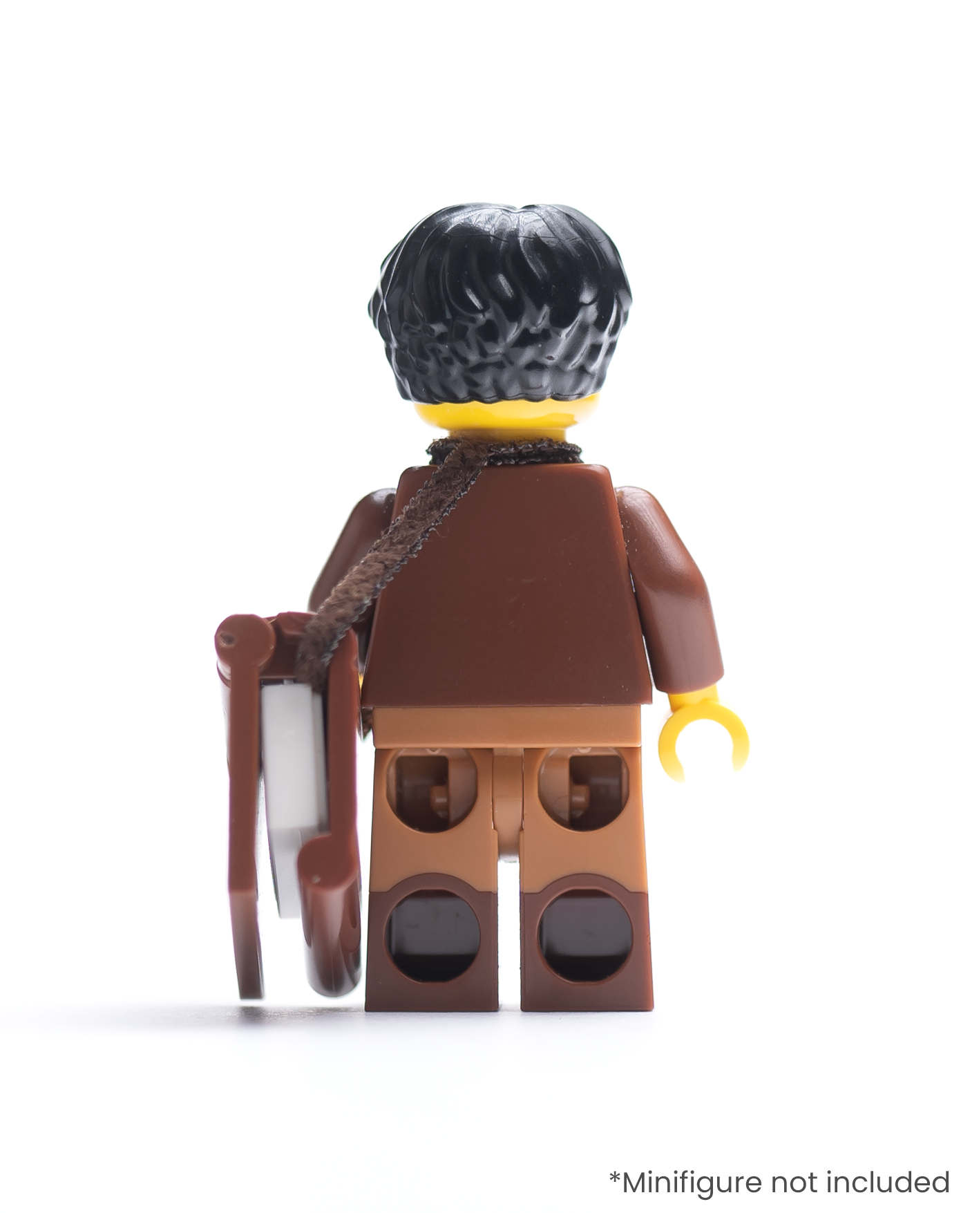 Rear view of LEGO minifigure with a book in a strap over its shoulder