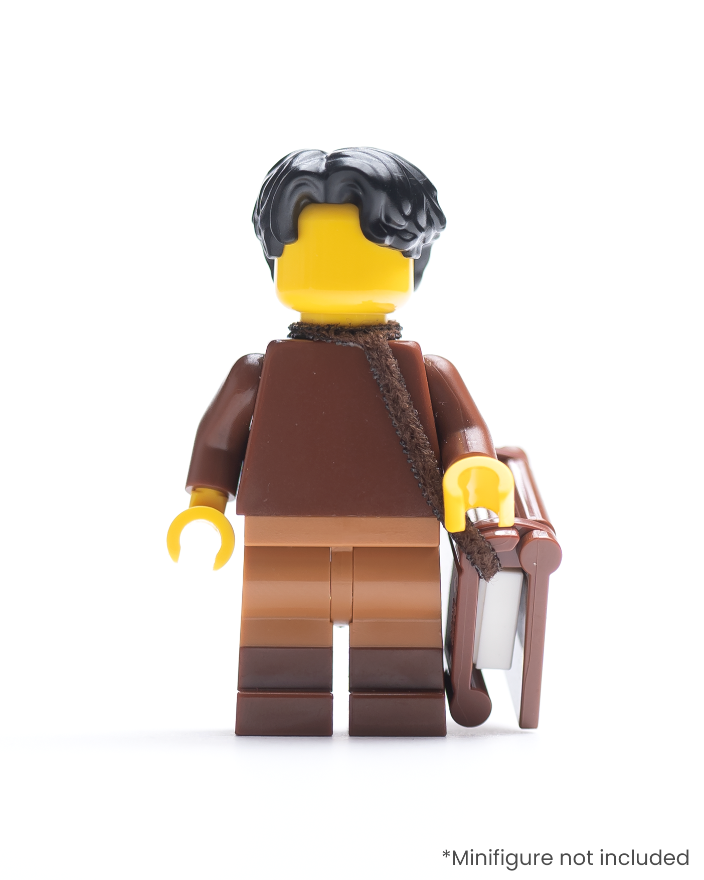 LEGO minifigure with a book in a strap over its shoulder