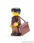LEGO minifigure with a book in a strap over its shoulder