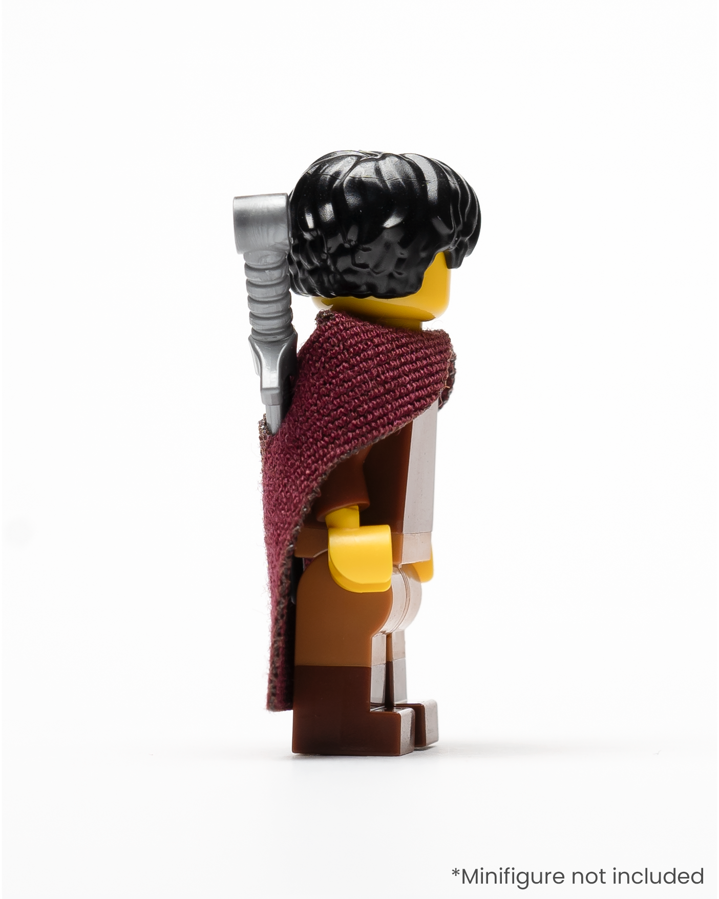 Profile of a LEGO minifigure wearing a dark red cloak and a sword in a sheath