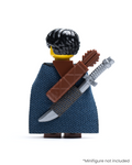 Rear view of LEGO minifigure wearing a dark blue cloak with a brown quiver and sword on its back against a white background